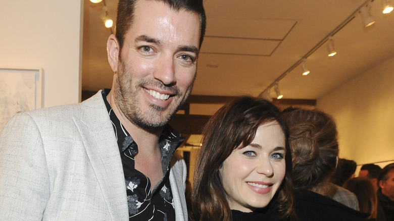 Jonathan Scott and Zooey Deschanel at an event