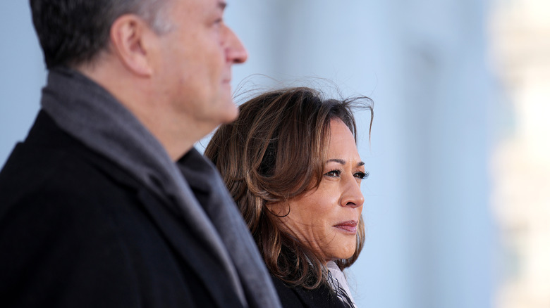 Doug Emhoff standing beside Kamala Harris