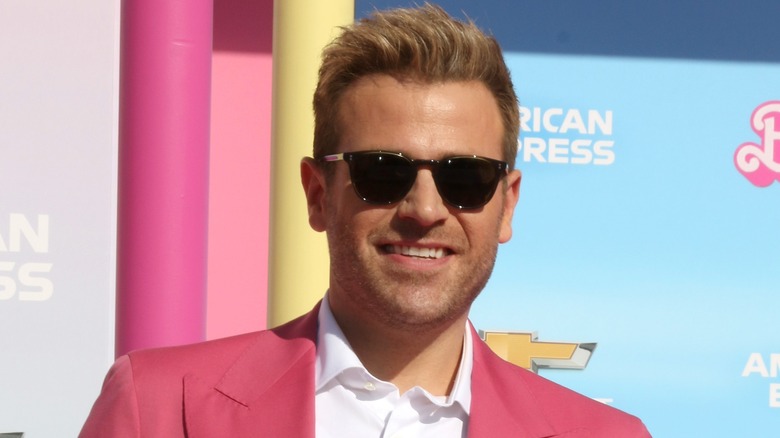 Scott Evans posing at the Barbie premiere 