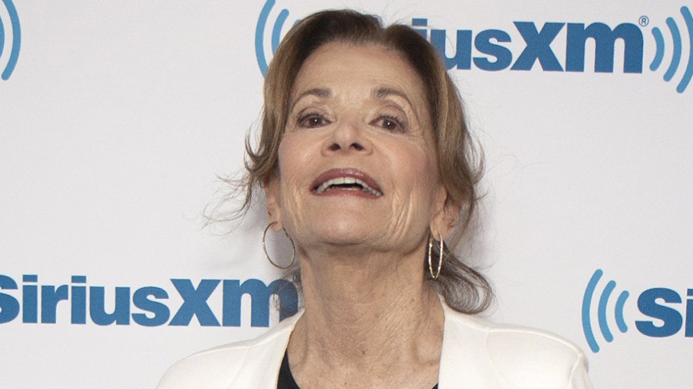 Jessica Walter laughing in front of SiriusXM wall