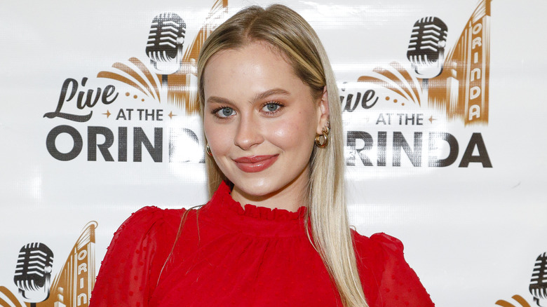 Natasha Bure wears a red dress