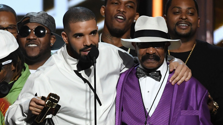 Drake and his dad Dennis Graham on stage