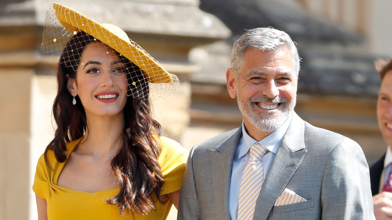 George Clooney and wife Amal smiling