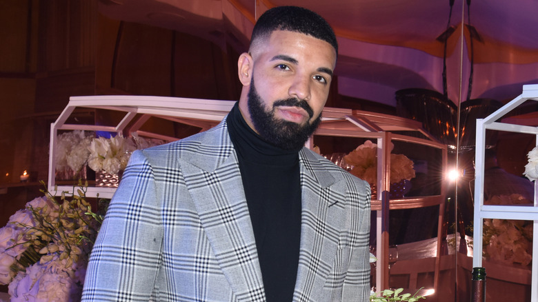 Drake wearing a suit