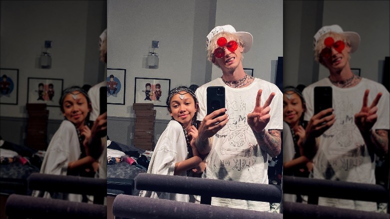 Machine Gun Kelly takes a selfie with his daughter