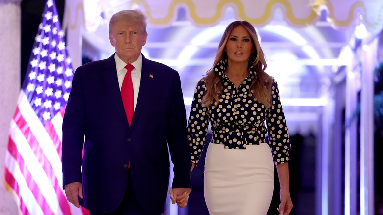 Donald and Melania Trump in front of US flag