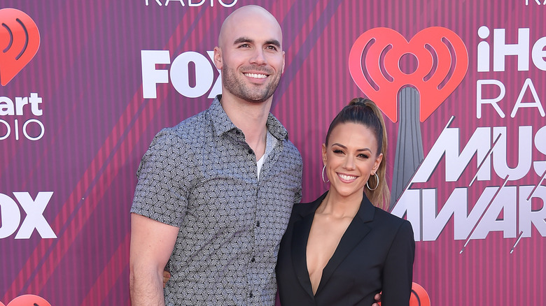 Mike Caussin and Jana Kramer on a red carpet