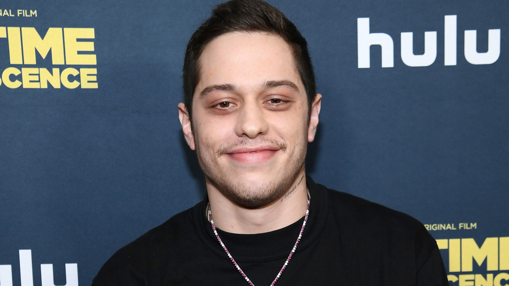 Pete Davidson poses at an event