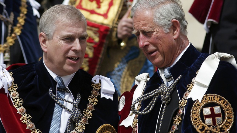 Prince Andrew and Prince Charles talking