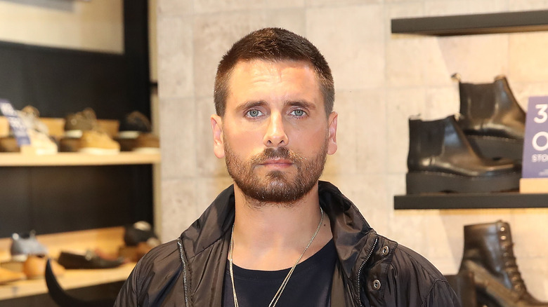 Scott Disick posing in shoe store