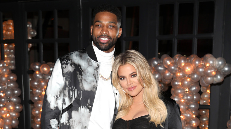 Tristan Thompson and Khloe Kardashian posing for a photo