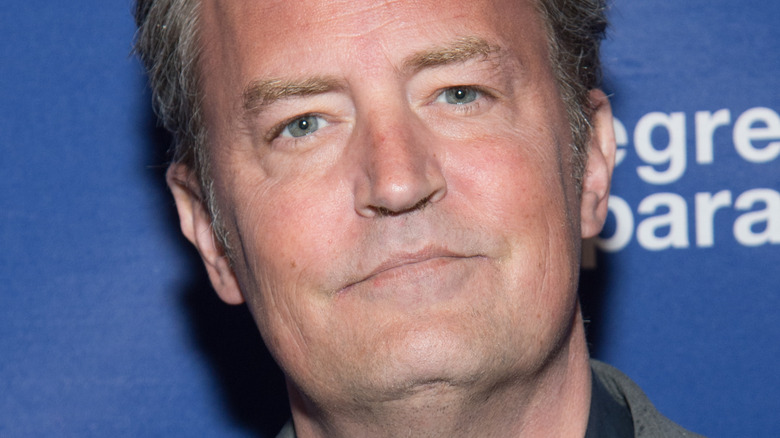 Matthew Perry looks serious on the red carpet