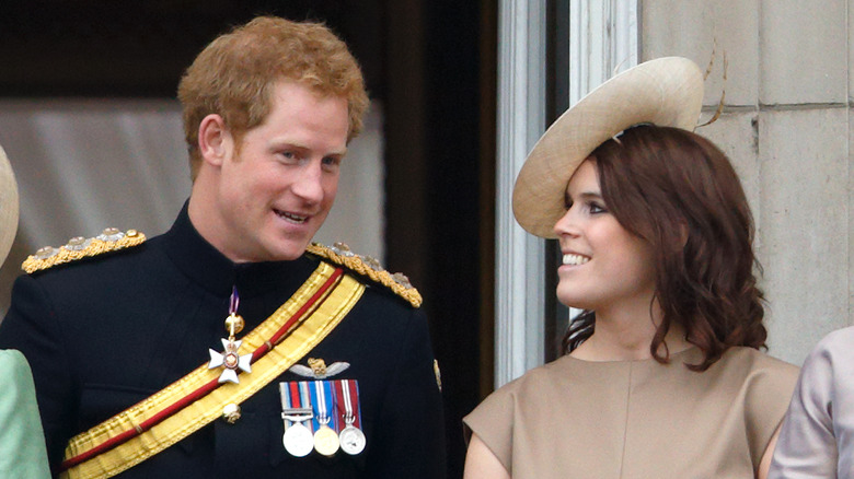 Prince Harry and Princess Eugenie talking.