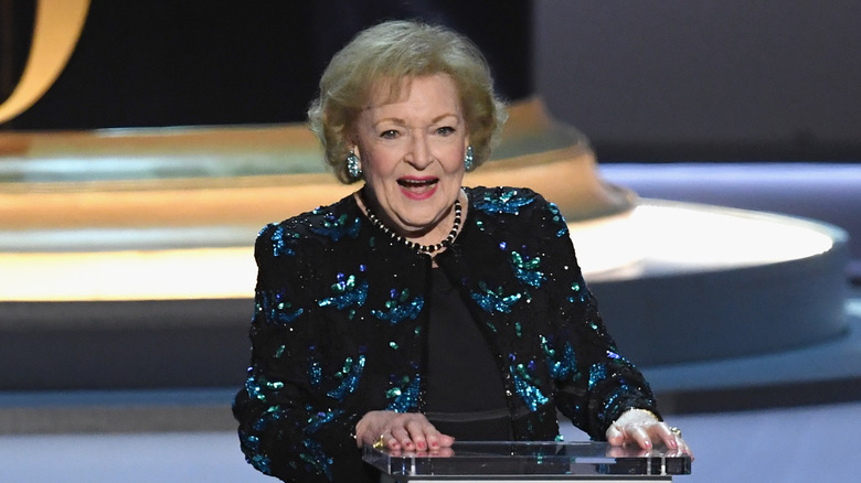 Betty White speaking at podium 