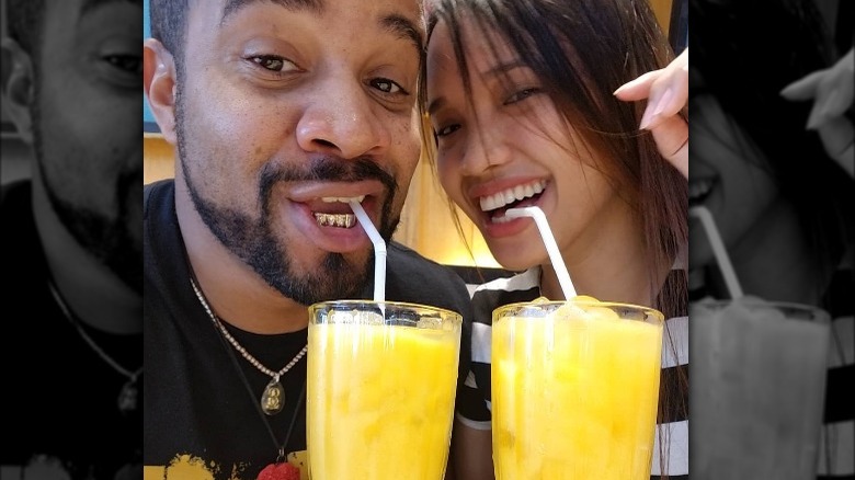 Tarik Myers and Hazel Cagalitan drinking juice