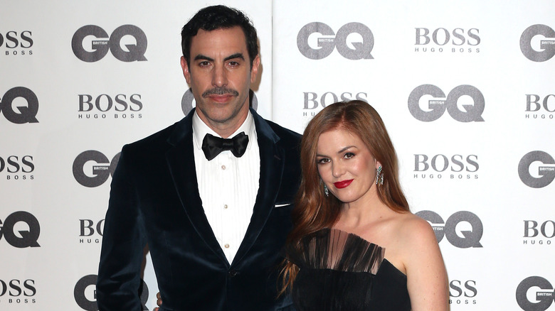 Sacha Baron Cohen and Isla Fisher posing