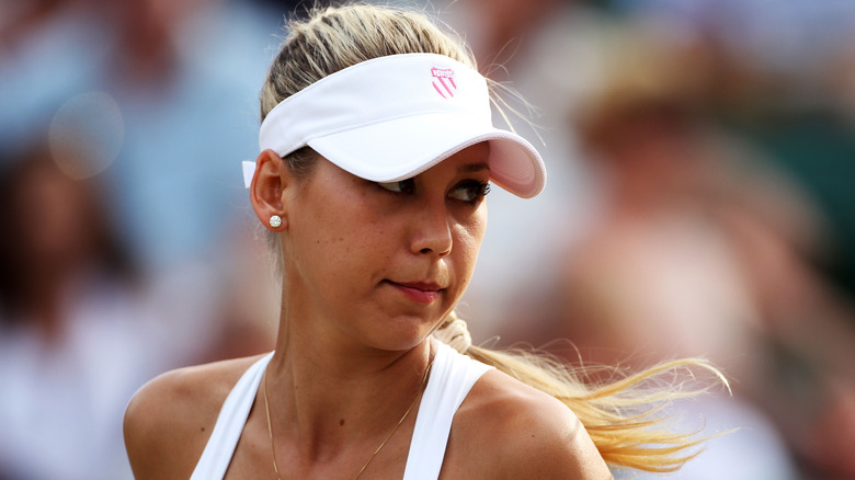 Anna Kournikova looks annoyed on the tennis court