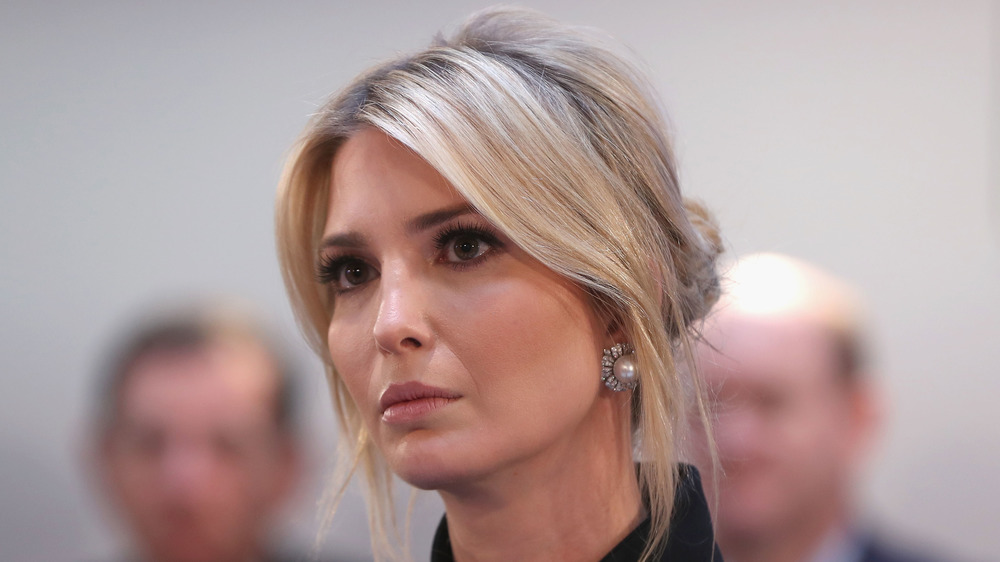 Ivanka Trump with hair up, looking serious