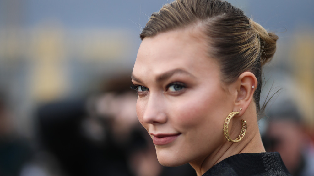 Karlie Kloss looking to the side