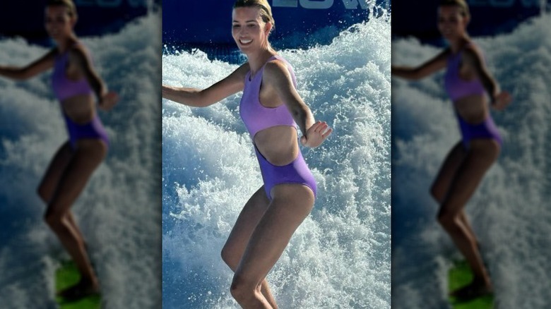 Ivanka Trump wearing a purple swimsuit