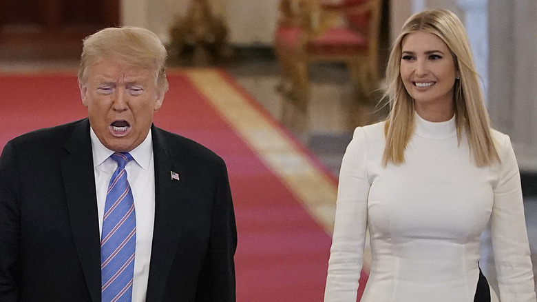 Donald Trump talking and Ivanka Trump smiling