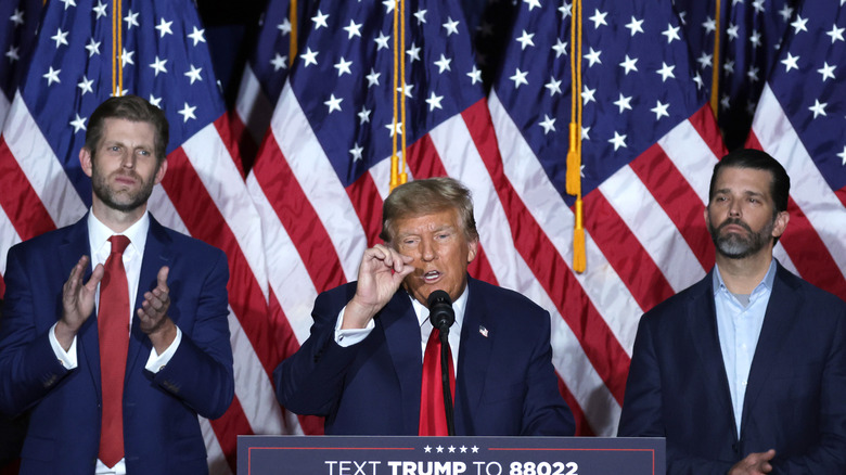 Donald Trump standing between sons Eric and Donald Jr.