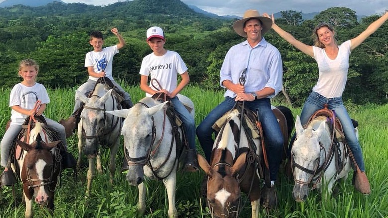 Tom Brady and family riding donkeys