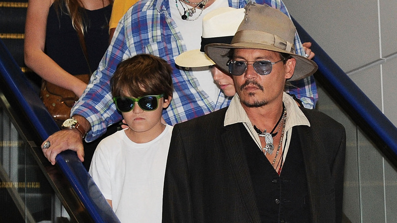 Jack and Johnny Depp coming down an escalator together.