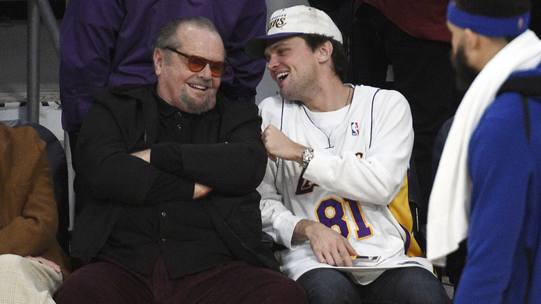 Jack and Ray Nicholson laughing at basketball game