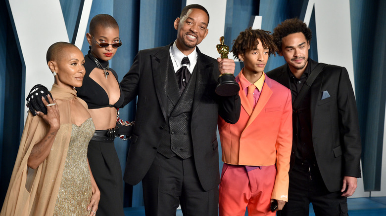 The Smith family posing after the Oscars