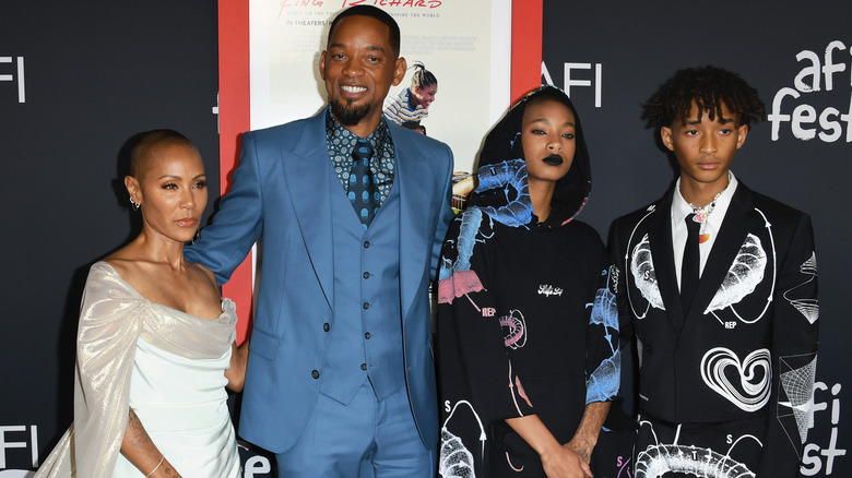 Jada Pinkett Smith posing with Will Smith, Willow Smith, and Jaden Smith on the red carpet