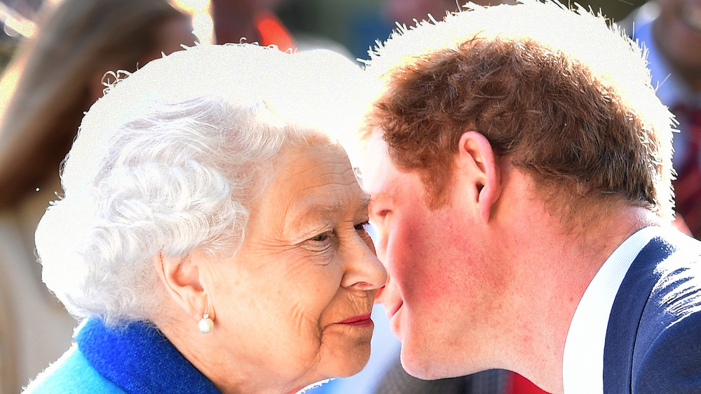 Queen Elizabeth Prince Harry leaning in for a kiss