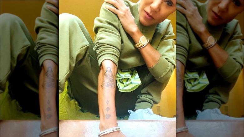 Jada Pinkett Smith showing her tattoos