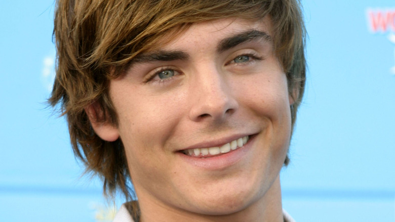 Zac Efron smiling on red carpet