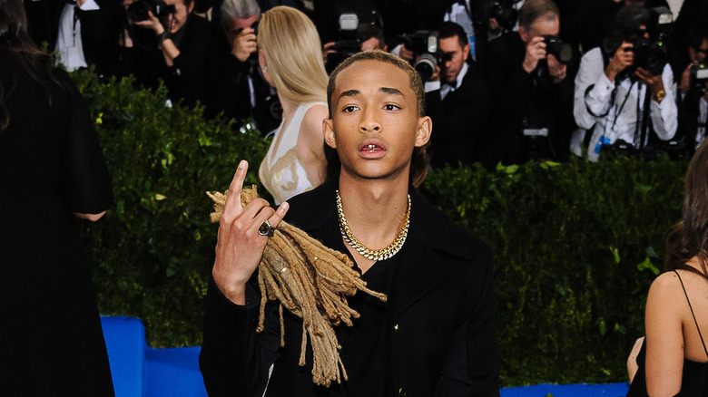 Jaden Smith holds his dreadlocks