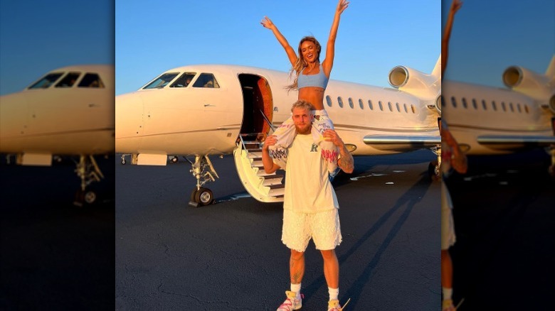 Jake Paul and Julia Rose outside a plane