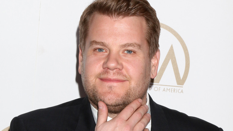 James Corden hand to face