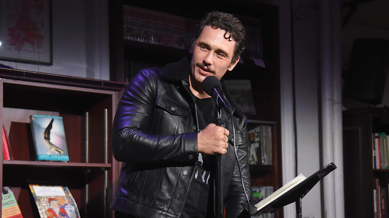 James Franco speaking into a microphone