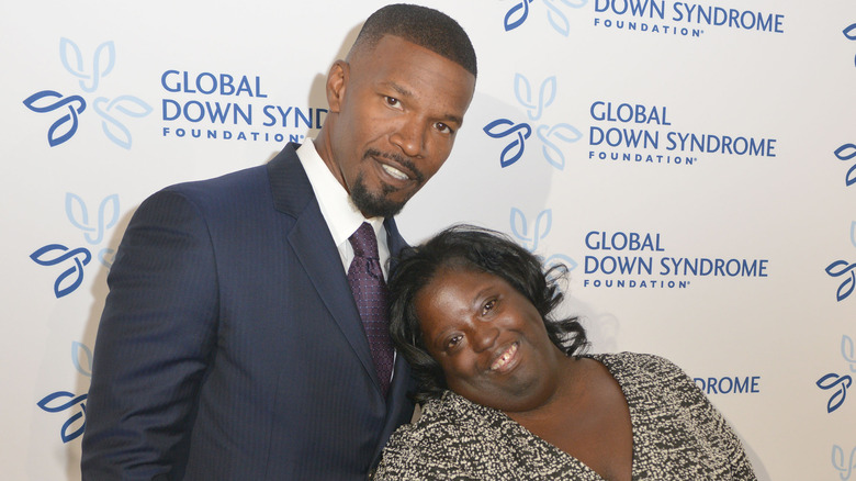 Jamie Foxx and DeOndra Dixon pose