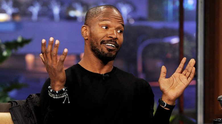 Jamie Foxx with hands up