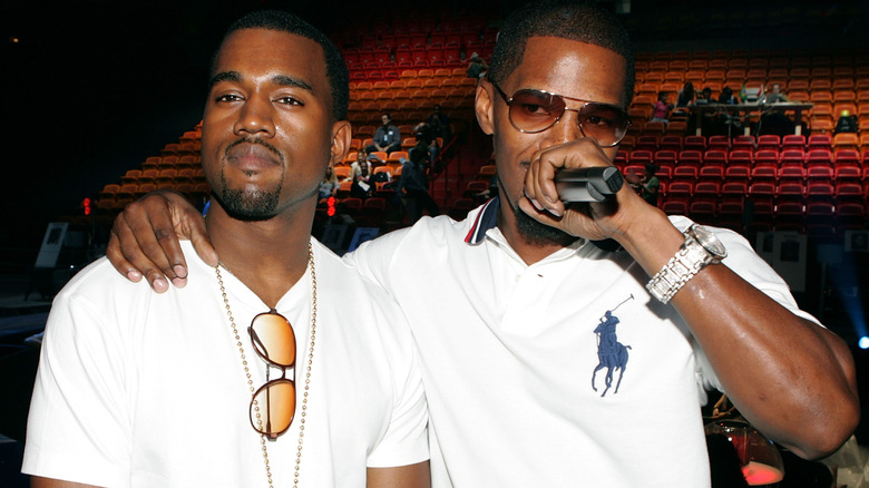 Jamie Foxx with arm around Kanye West