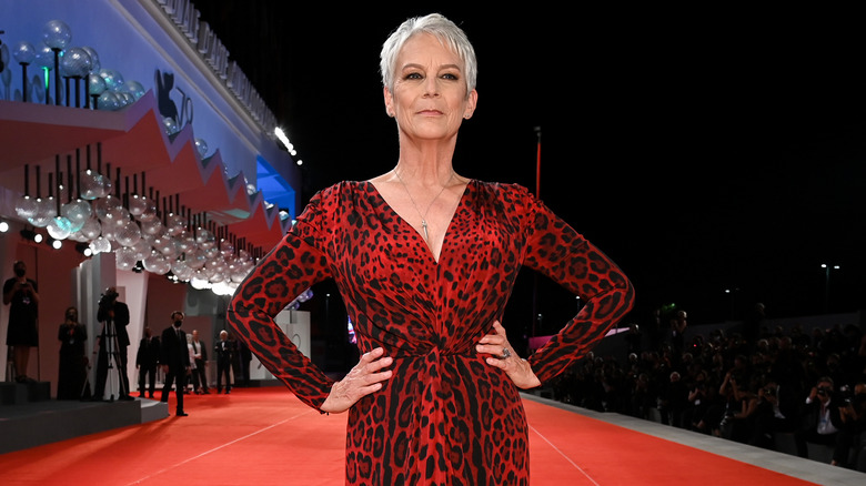 Jamie Lee Curtis with hands on hips like a queen