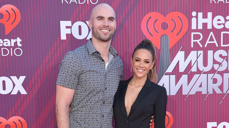 Jana Kramer and Mike Caussin pose 