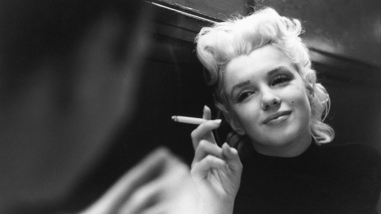 Marilyn Monroe smoking a cigarette