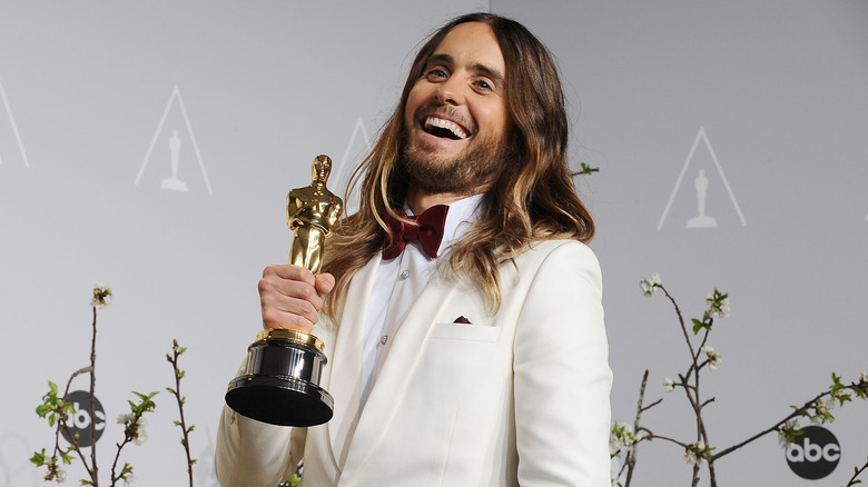 Jared Leto holds his Oscar