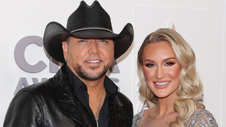 Jason Aldean and wife Brittany Aldean smiling