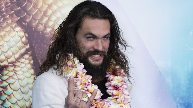 Jason Momoa wears a lei