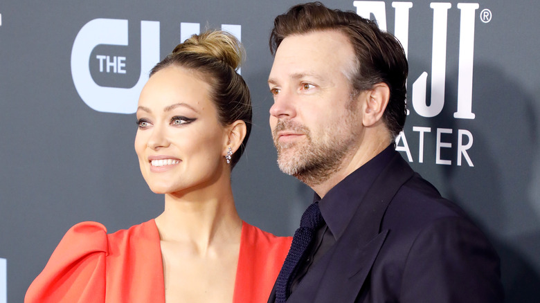 Olivia Wilde smiling with Jason Sudeikis