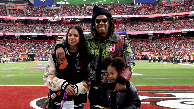 Jay-Z poses with Blue Ivy and Rumi at the Super Bowl in 2024