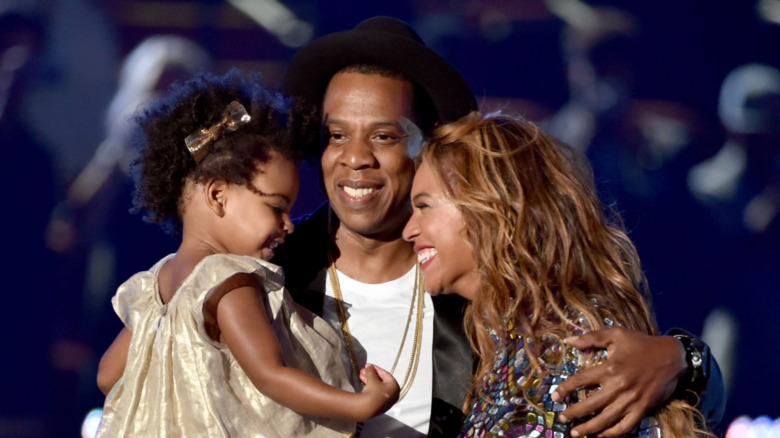 Jay Z, Blue Ivy, and Beyonce hugging